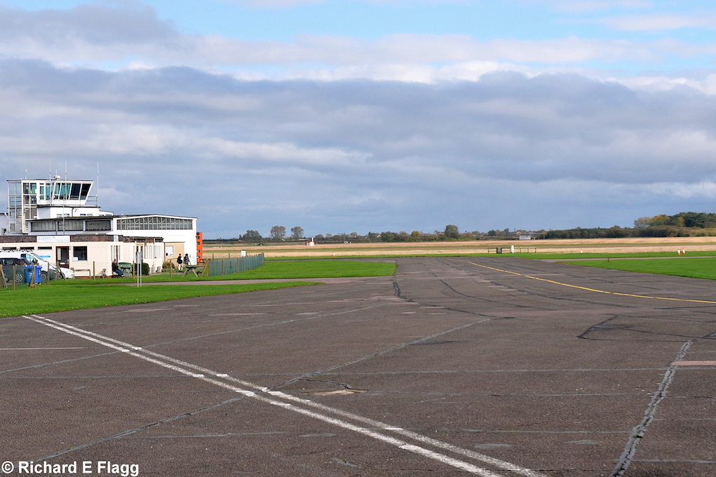 009Taxiway at the west of the airfield. Looking north east towards the Control Tower - 26 October 2013.png