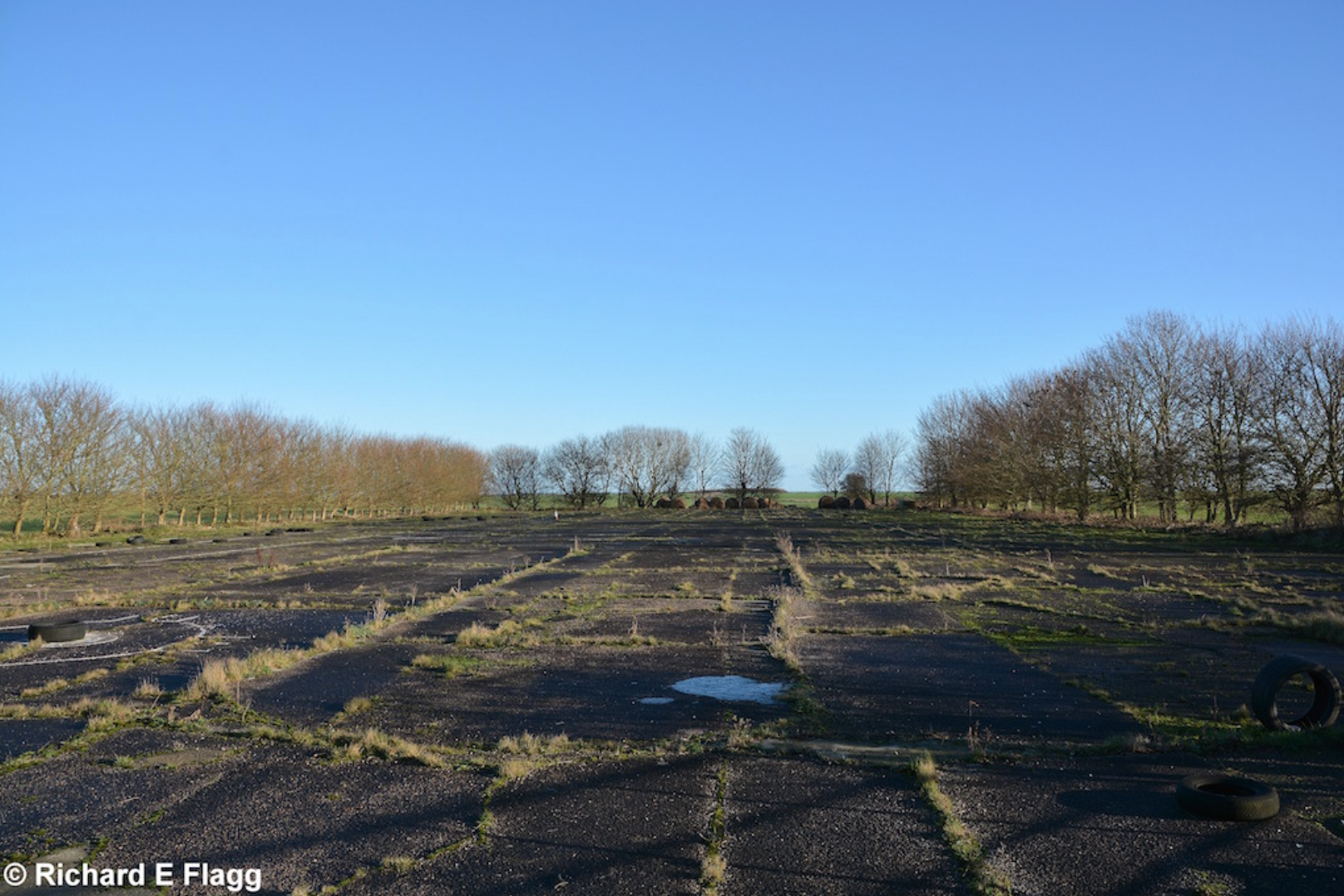 006Runway 06:24. Looking north east from the road that crosses the airfield - 31 December 2015.png